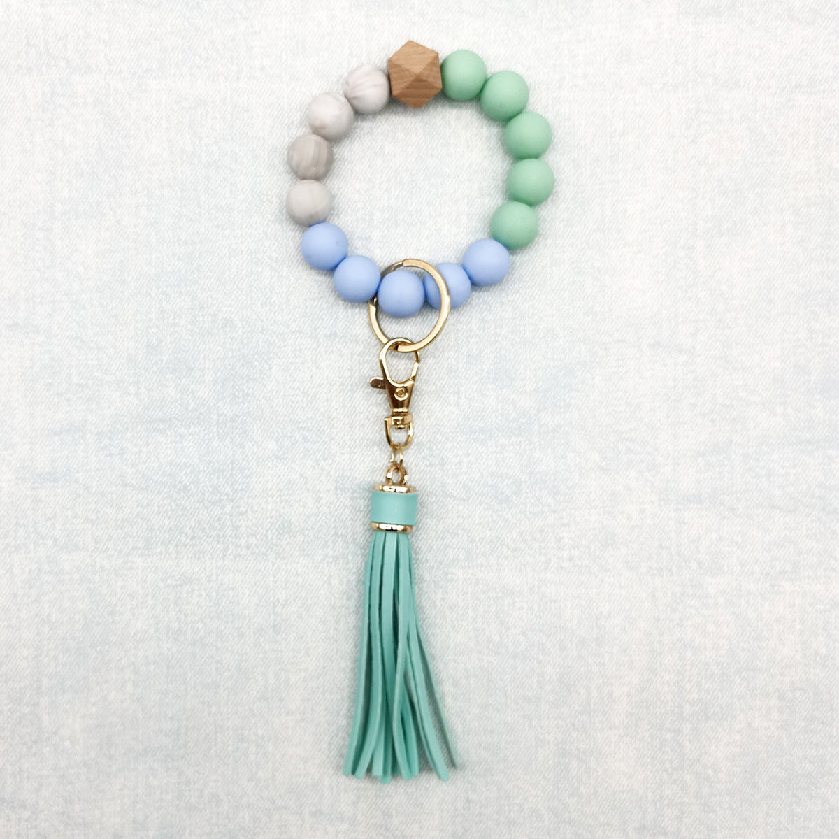 Pulsera de cuentas de silicona con borlas al por mayor llavero de muñeca